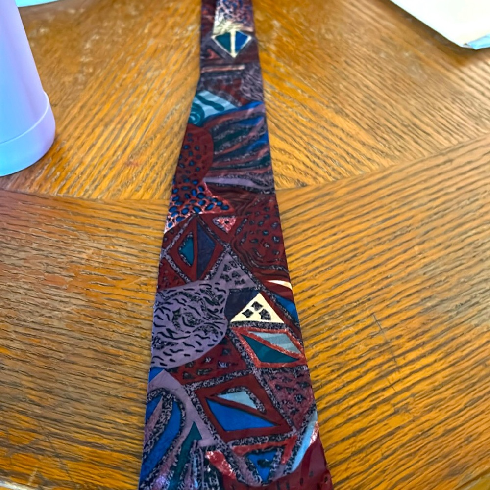 Designer ties also designer suits, shoes, dress shirts, m ns swimming trunks